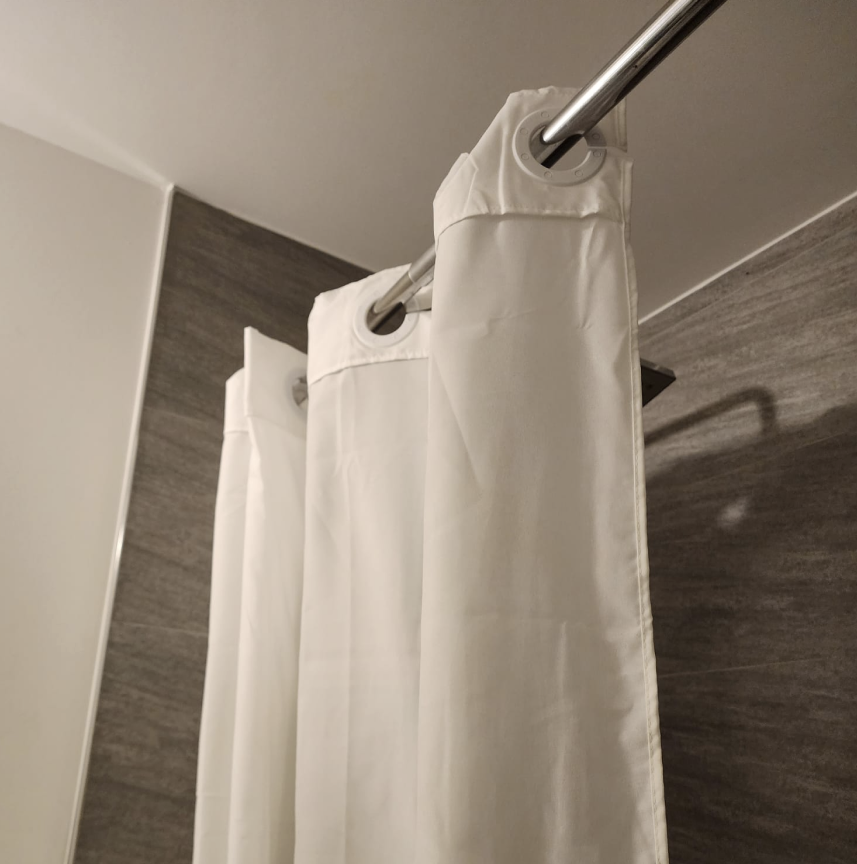 Extending shower curtain