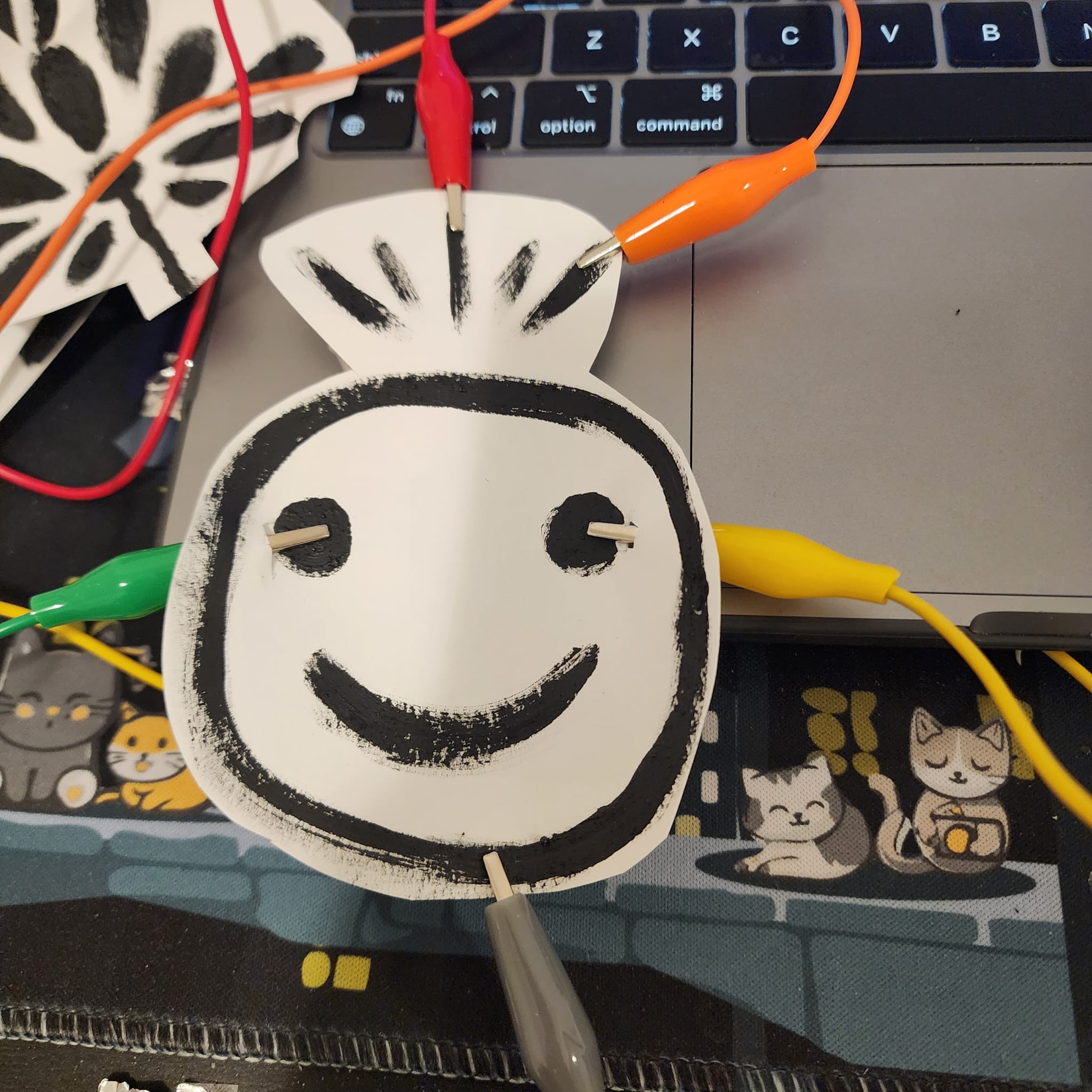 Smiley face with hair conductive painting